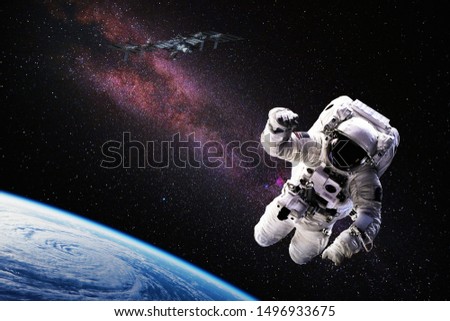 Astronaut in outer space over the planet Earth. Our home. ISS. Elements of this image furnished by NASA
