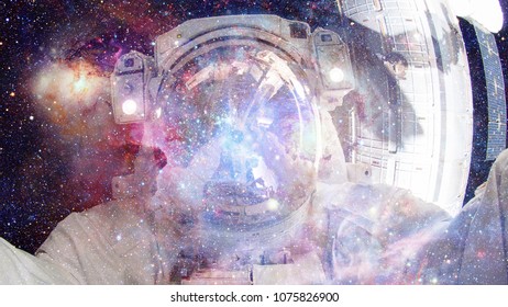 Astronaut in outer space. Science fiction art. Elements of this image furnished by NASA. - Shutterstock ID 1075826900
