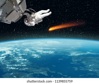 Astronaut over the earth, comet flying near. The elements of this image furnished by NASA.