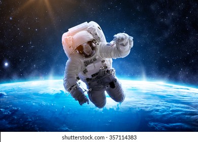 Astronaut Over Earth - Elements of this Image Furnished by NASA