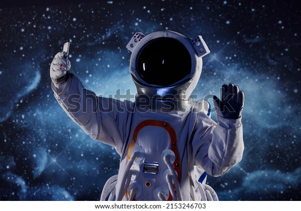 Astronaut saying hello to\
mobile phone