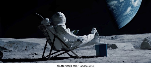 Astronaut sits in a beach chair on a Moon surface, holding phone in hands