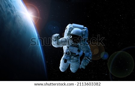 ASTRONAUT IN SPACE. Elements of this image furnished by NASA 