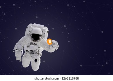Astronaut in space holding Bitcoin. The elements of this image furnished by NASA