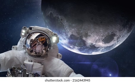 Astronaut In Space Near Moon. Artemis Space Program. Spacewalk Of Spaceman. Elements Of This Image Furnished By NASA