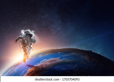 Astronaut In Space On Planet Orbit.