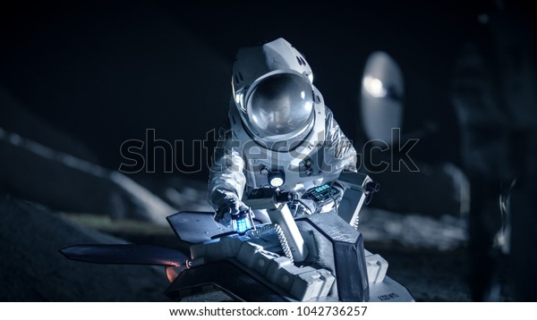 Astronaut in Space Suit on an Alien\
Planet Prepare Space Rover for Planet\'s Surface Exploration\
Expedition. Space Travel and Solar System Colonization\
Concept.