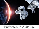 Astronaut spaceman do spacewalk while working for space station in outer space . Astronaut wear full spacesuit for space operation . Elements of this image furnished by NASA space astronaut photos.