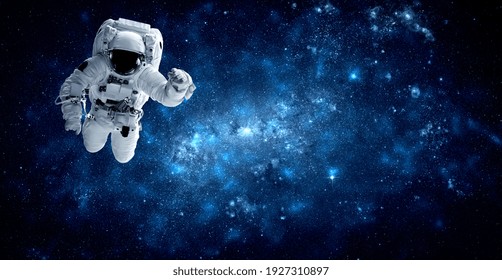 Astronaut spaceman do spacewalk while working for space station in outer space . Astronaut wear full spacesuit for space operation . Elements of this image furnished by NASA space astronaut photos.