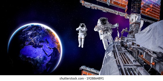 Astronaut spaceman do spacewalk while working for space station in outer space . Astronaut wear full spacesuit for space operation . Elements of this image furnished by NASA space astronaut photos. - Powered by Shutterstock