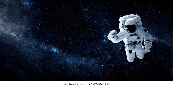 Astronaut spaceman do spacewalk while working for space station in outer space . Astronaut wear full spacesuit for space operation . Elements of this image furnished by NASA space astronaut photos. - Powered by Shutterstock