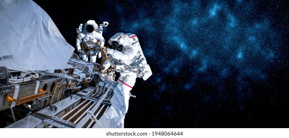 Astronaut spaceman do spacewalk while working for space station in outer space . Astronaut wear full spacesuit for space operation . Elements of this image furnished by NASA space astronaut photos.