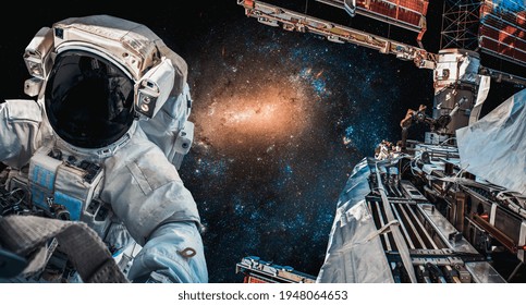 Astronaut spaceman do spacewalk while working for space station in outer space . Astronaut wear full spacesuit for space operation . Elements of this image furnished by NASA space astronaut photos.