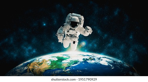 Astronaut spaceman do spacewalk while working for space station in outer space . Astronaut wear full spacesuit for space operation . Elements of this image furnished by NASA space astronaut photos. - Powered by Shutterstock