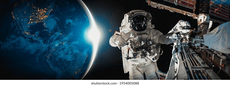 Astronaut spaceman do spacewalk while working for space station in outer space . Astronaut wear full spacesuit for space operation . Elements of this image furnished by NASA space astronaut photos. - Powered by Shutterstock