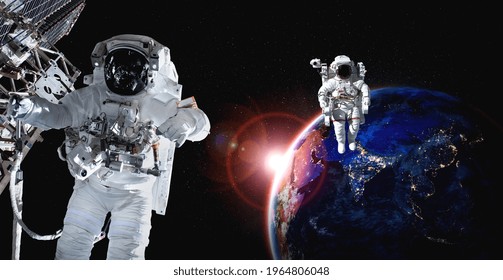 Astronaut spaceman do spacewalk while working for space station in outer space . Astronaut wear full spacesuit for space operation . Elements of this image furnished by NASA space astronaut photos.