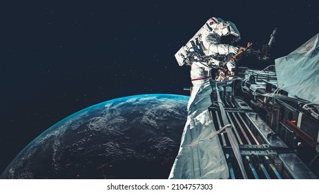 Astronaut spaceman do spacewalk while working for spaceflight mission at space station . Astronaut wear full spacesuit for operation . Elements of this image furnished by NASA space astronaut photos . - Powered by Shutterstock