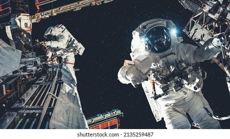 Astronaut spaceman do spacewalk while working for spaceflight mission at space station . Astronaut wear full spacesuit for operation . Elements of this image furnished by NASA space astronaut photos . - Powered by Shutterstock
