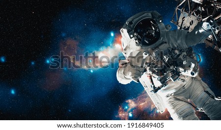 Astronaut spaceman do spacewalk while working for space station in outer space . Astronaut wear full spacesuit for space operation . Elements of this image furnished by NASA space astronaut photos.