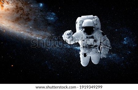 Astronaut spaceman do spacewalk while working for space station in outer space . Astronaut wear full spacesuit for space operation . Elements of this image furnished by NASA space astronaut photos.