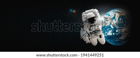 Astronaut spaceman do spacewalk while working for space station in outer space . Astronaut wear full spacesuit for space operation . Elements of this image furnished by NASA space astronaut photos.