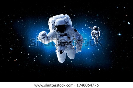 Astronaut spaceman do spacewalk while working for space station in outer space . Astronaut wear full spacesuit for space operation . Elements of this image furnished by NASA space astronaut photos.