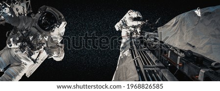 Astronaut spaceman do spacewalk while working for space station in outer space . Astronaut wear full spacesuit for space operation . Elements of this image furnished by NASA space astronaut photos.