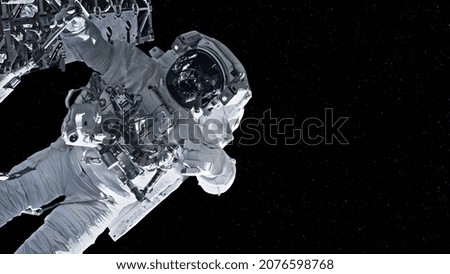 Astronaut spaceman do spacewalk while working for spaceflight mission at space station . Astronaut wear full spacesuit for operation . Elements of this image furnished by NASA space astronaut photos .
