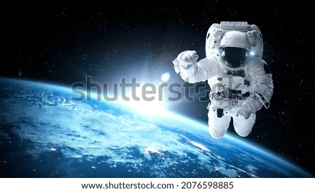 Astronaut spaceman do spacewalk while working for spaceflight mission at space station . Astronaut wear full spacesuit for operation . Elements of this image furnished by NASA space astronaut photos .