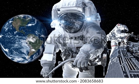 Astronaut spaceman do spacewalk while working for spaceflight mission at space station . Astronaut wear full spacesuit for operation . Elements of this image furnished by NASA space astronaut photos .