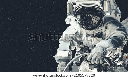 Astronaut spaceman do spacewalk while working for spaceflight mission at space station . Astronaut wear full spacesuit for operation . Elements of this image furnished by NASA space astronaut photos .