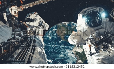 Astronaut spaceman do spacewalk while working for spaceflight mission at space station . Astronaut wear full spacesuit for operation . Elements of this image furnished by NASA space astronaut photos .