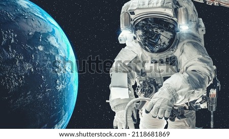 Astronaut spaceman do spacewalk while working for spaceflight mission at space station . Astronaut wear full spacesuit for operation . Elements of this image furnished by NASA space astronaut photos .