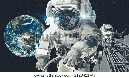 Astronaut spaceman do spacewalk while working for spaceflight mission at space station . Astronaut wear full spacesuit for operation . Elements of this image furnished by NASA space astronaut photos .