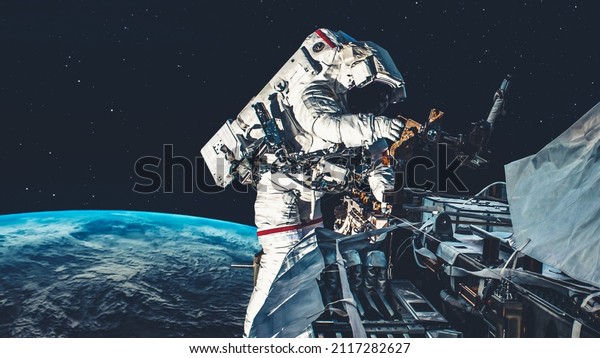 Astronaut spaceman do spacewalk while working for\
spaceflight mission at space station . Astronaut wear full\
spacesuit for operation . Elements of this image furnished by NASA\
space astronaut photos\
.