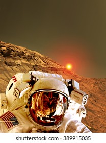 Astronaut spaceman helmet planet Mars surface martian colony space landscape. Elements of this image furnished by NASA.