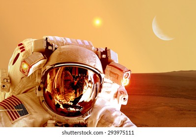 Astronaut spaceman helmet space planet Mars apocalypse moon. Elements of this image furnished by NASA.