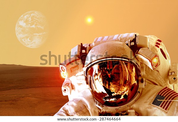 Astronaut spaceman helmet\
space planet Mars apocalypse Earth. Elements of this image\
furnished by NASA.