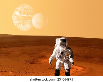 Astronaut spaceman planet Mars surface space. Elements of this image furnished by NASA.