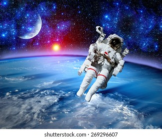 Astronaut spaceman space suit cosmonaut moon earth sun. Elements of this image furnished by NASA.