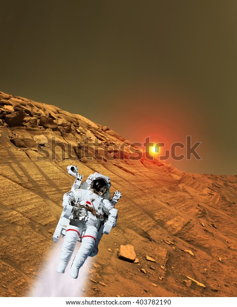 Astronaut\
spaceman suit planet Mars jet pack jetpack space landscape.\
Elements of this image furnished by\
NASA.