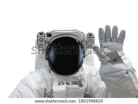 Astronaut in spacesuit raise hand as greeting. Isolated on white background. Elements of this image furnished by NASA
