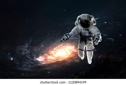 Astronaut at spacewalk, EVA, awesome science fiction wallpaper. Elements of this image furnished by NASA - Powered by Shutterstock