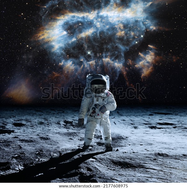 Astronaut at the spacewalk on\
the moon. National Moon Day. This image elements furnished by\
NASA.