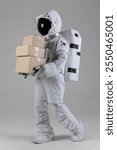 Astronaut walking holding a courier box, white background