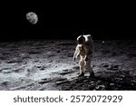 Astronaut is walking on the moon. With land on the horizon. Elements of this image were furnished by NASA. 