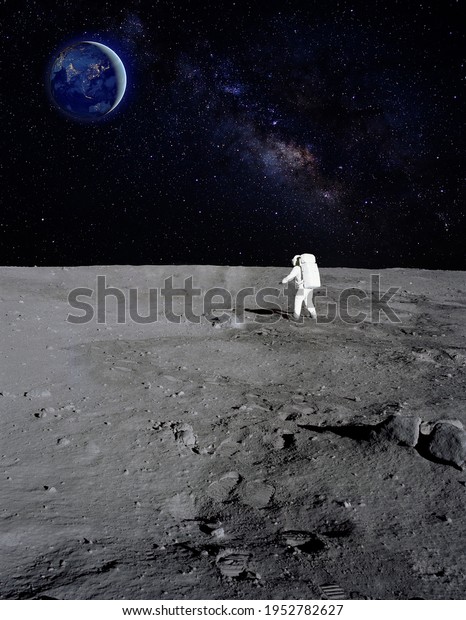 An\
astronaut walking on the surface of the moon with earth on the\
background. Elements of this image furnished by\
NASA.