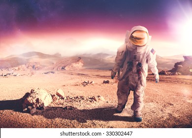 Astronaut walking on an unexplored planet "Elements of this image were NOT furnished by NASA"