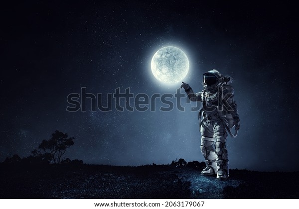 Astronaut walking on an\
unexplored planet