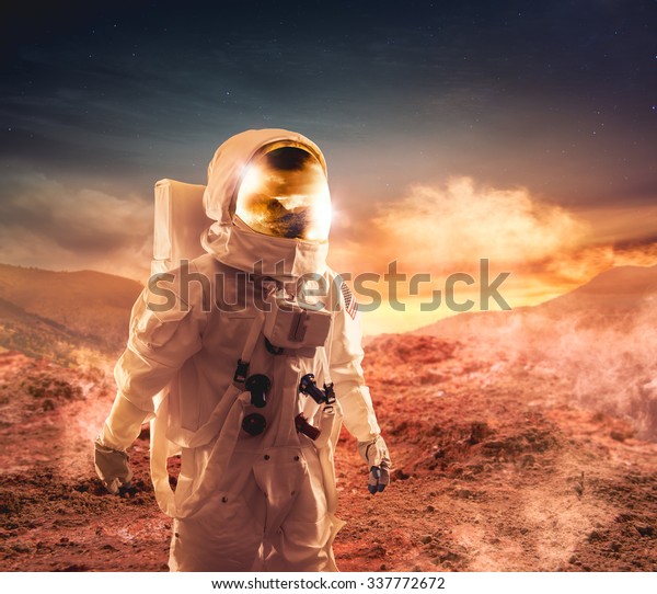 Astronaut walking on an\
unexplored planet